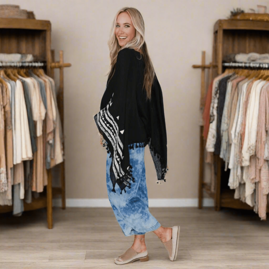 Black embroidered sleeve poncho for women
Stylish tassel poncho top with embroidery
Boho-inspired black poncho with tassels
Women's embroidered black poncho with sleeves
Lightweight black poncho top with tassel details
Embroidered poncho for boho chic style
Black boho poncho top with intricate embroidery