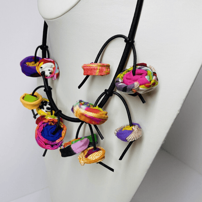 Colorful string necklace for boho fashion Women's fashion necklace with bold design Black and white beaded necklace for women Modern artisan necklace for everyday wear Handmade colorful jewelry for statement fashion Women's necklace with creative design Boho-style colorful necklace for women Artisan jewelry necklace with bold colors Unique handcrafted necklace for casual outfits Queen of String handmade beaded necklace