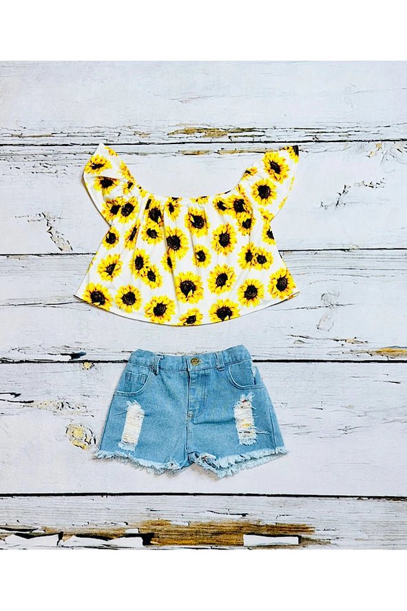 Radiate sunshine vibes with our Girls' Sunflower Off-the-Shoulder Top and Denim Shorts 3pc Set! Embrace the essence of summer with vibrant sunflower prints and trendy denim shorts. Perfect for picnics, beach days, or casual outings, this set offers both style and comfort. Elevate your summer wardrobe with this must-have ensemble! Shop now and soak up the sun in style